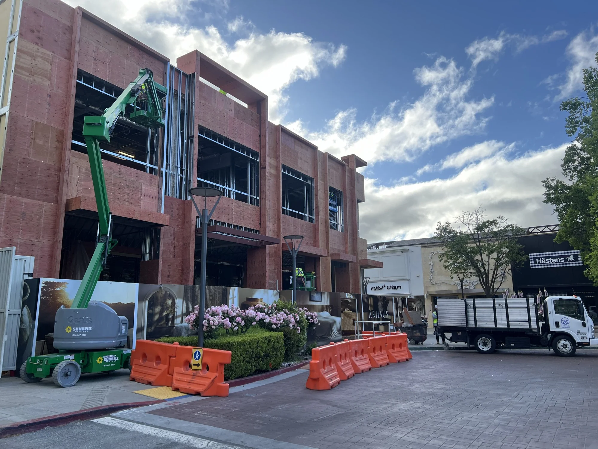 Exterior sheathing and framing with boom lift