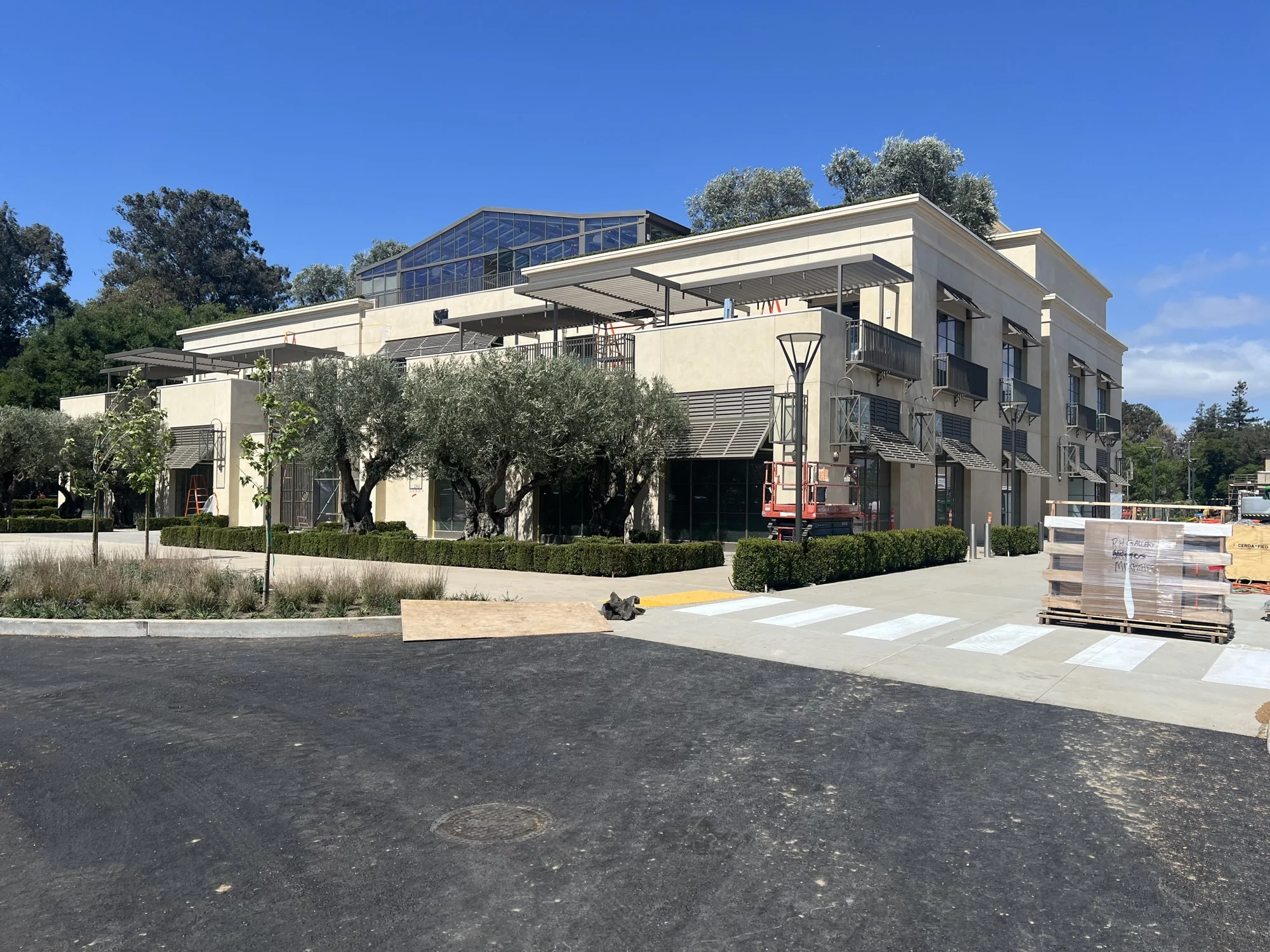 Commercial building exterior with landscaped frontage and metal canopies